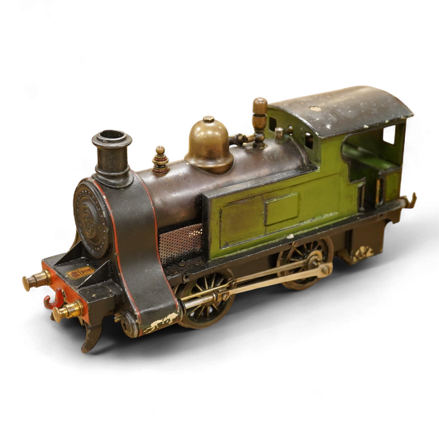 An early 20th century Gauge One Bing live steam 0-4-0T ‘I48’ locomotive, with a spirit fired pot boiler, driving a single oscillating vertical cylinder mounted in the cab, with twin outside dummy cylinders, the regulator